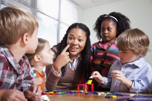 Preschool children in classroom with teacher