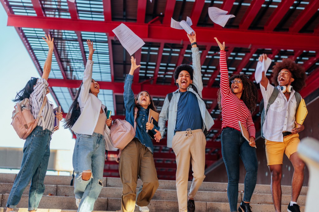 Happy students celebrate exam results.