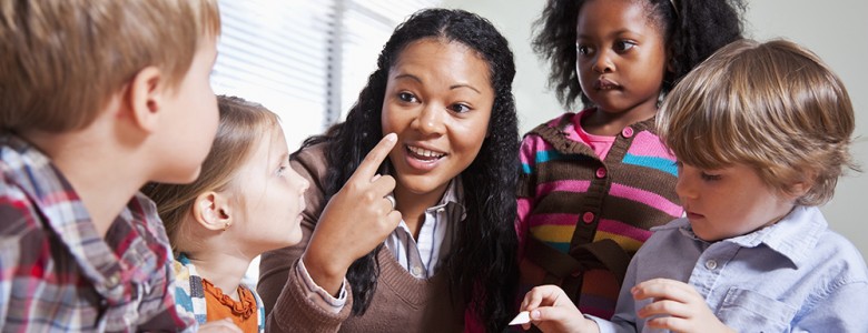 Preschool children in classroom with teacher