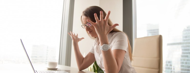 Angry businesswoman having problem with computer, broken laptop, lost data